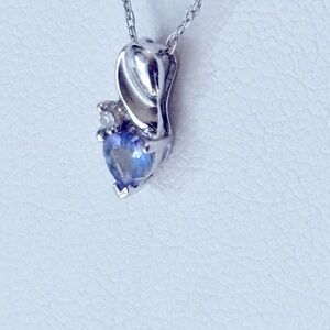 Elegant 10k tanzanite and diamond pendant with 10k chain included.